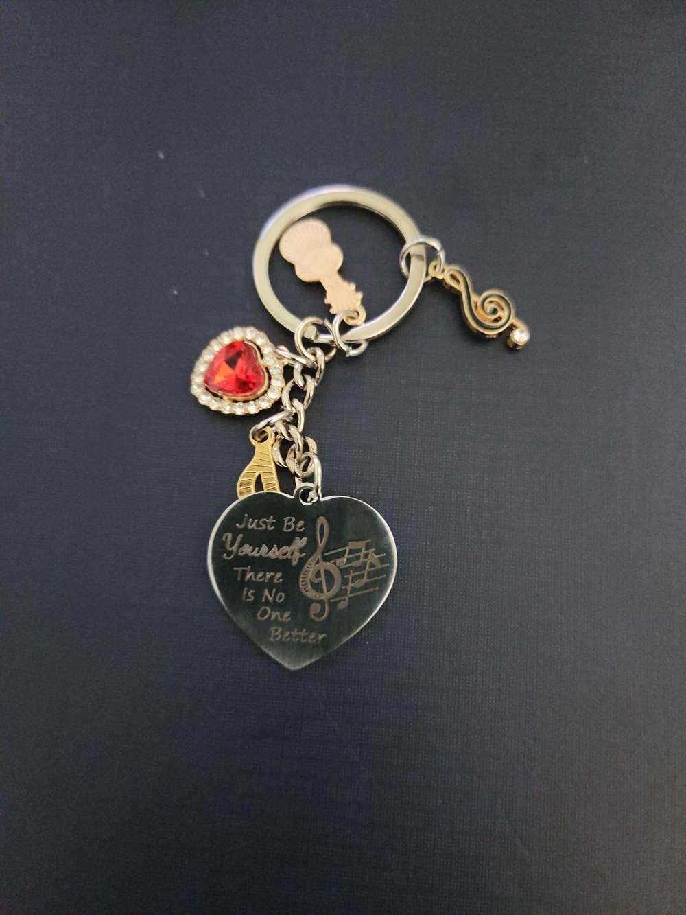 Hand Crafted Gold-Tone Heart Musical Keychain with Red Gem